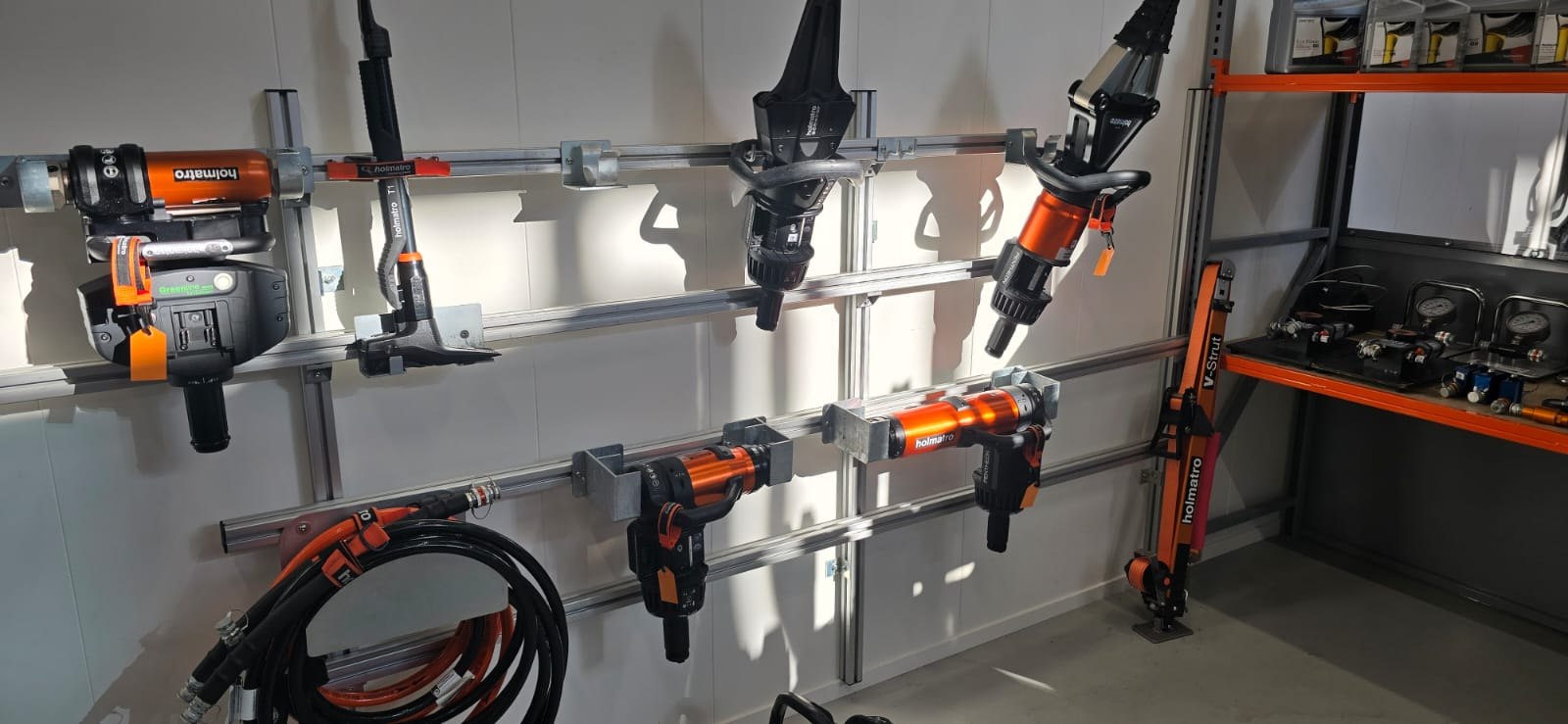 Wall-mounted rescue tool storage system